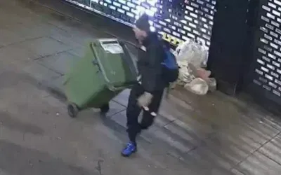 Hırsız, çöp bidonuyla binlerce dolarlık kıyafetleri çaldı