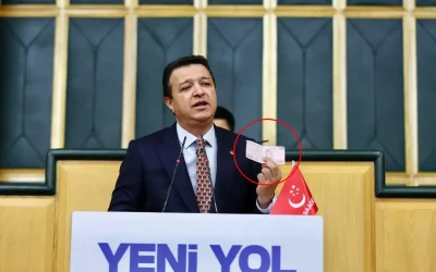 Arıkan, 200 TL ile aldığı ürünleri kürsüde sıraladı.